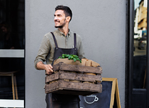 A man holding a wooden box