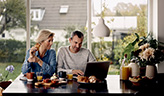 Couple talking in kitchen